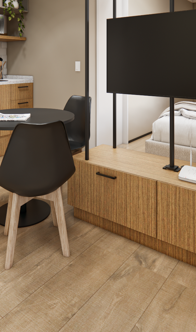 Render 3D de estúdio no ML - Brasilio 177 com cozinha linear, mesa redonda preta, marcenaria em madeira e TV em suporte