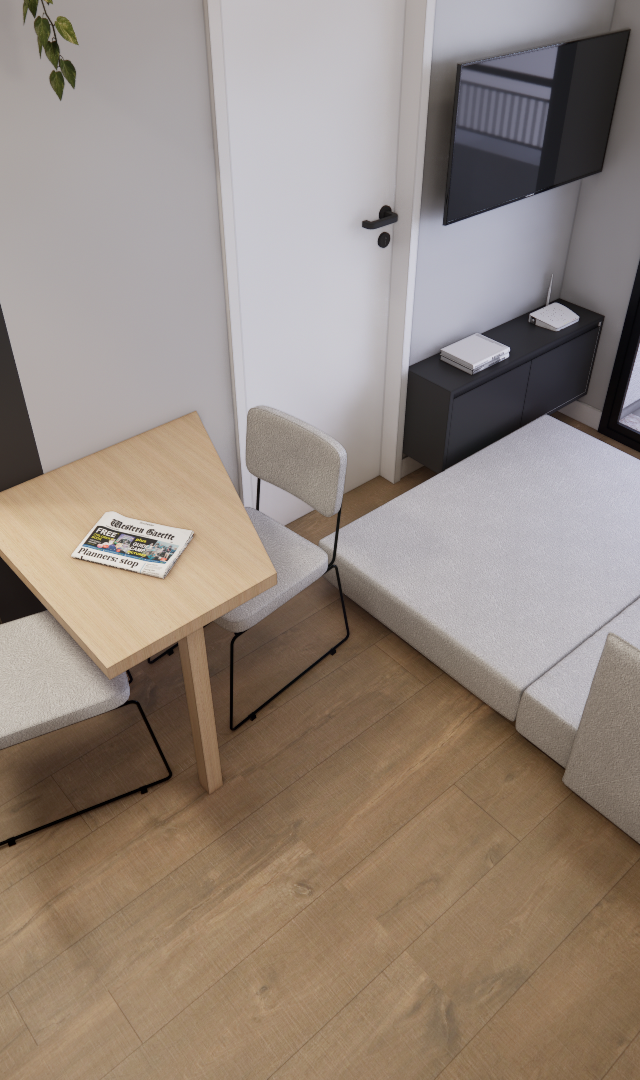 Render 3D de apartamento compacto com mesa de madeira, cadeiras cinza, sofá-cama, cozinha integrada e piso amadeirado
