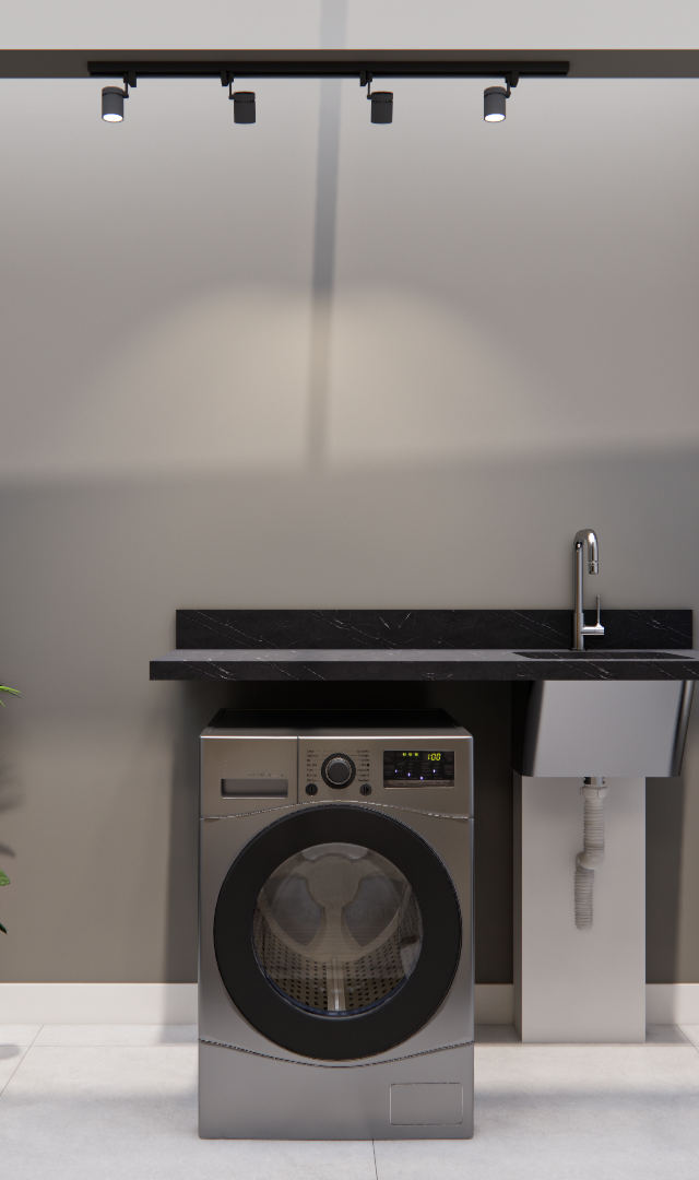 Render 3D de lavanderia no RM - NEXT VILA NOVA, com máquina lava e seca, tanque inox, bancada preta e iluminação em trilho